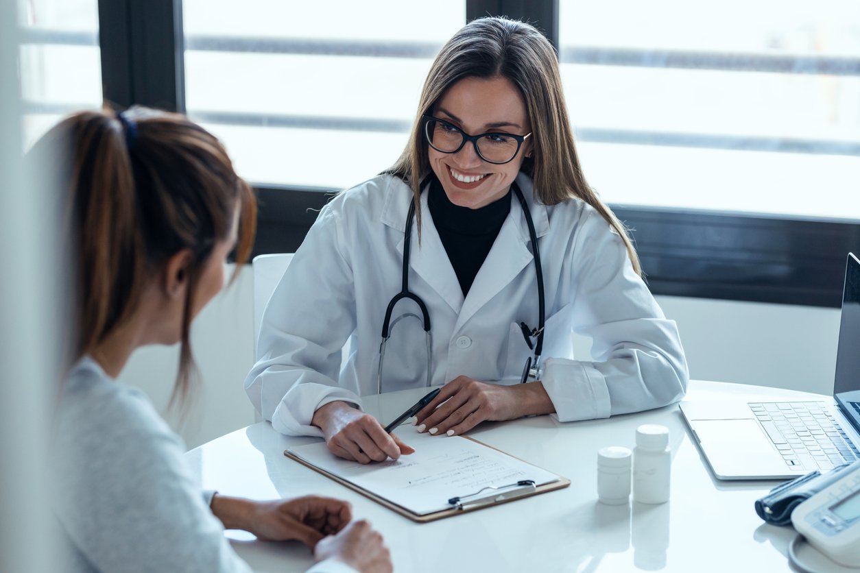 Woman DPC doctor with patient